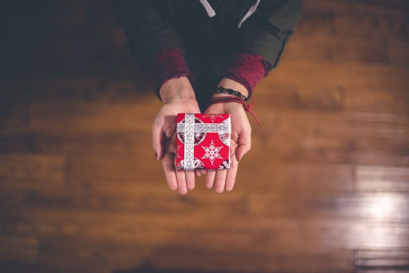 Hands giving a gift, symbolizing generosity and grace